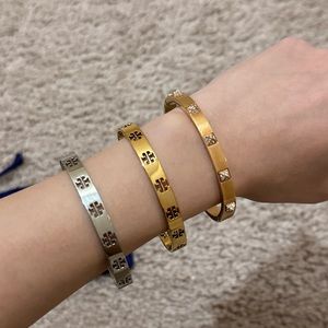Tory Burch Cuffs Bracelet x2
SWAROVSKI Tactic bangle Size S